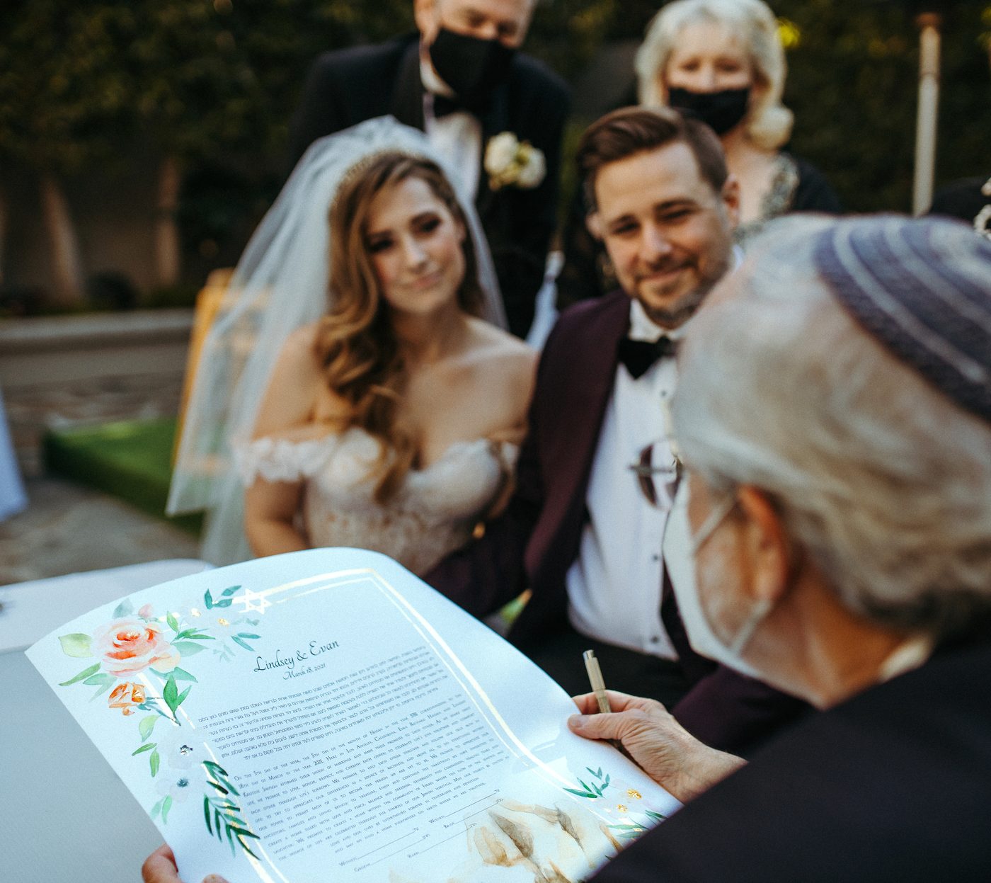 Lindsey & Evan — signing with the rabbi